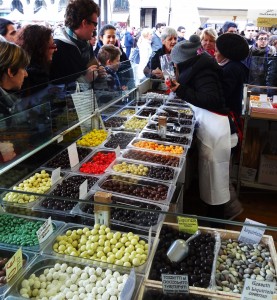 chocolate vendors selling different types of chocolates to customers during Turin Chocolate Festival