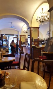 Gelateria Pepino interior photo of cafe with tables and red velvet seating